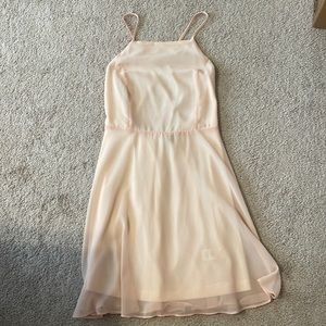 Lulus light pink dress w/crisscross straps. Size M. Worn once. Smoke free home.